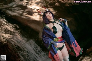 A woman in a kimono with horns on her head.