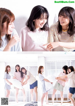 A group of young women laying on top of a bed.