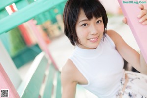 A woman in a pink bra and panties posing for a picture.