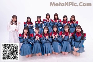 A group of young women in school uniforms posing for a magazine.