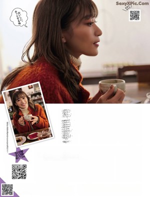A woman in a colorful kimono is posing for a magazine.